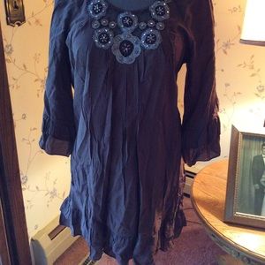 Chocolate brown ruffle tunic with beading.